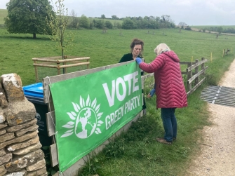 Voting banner being put up.